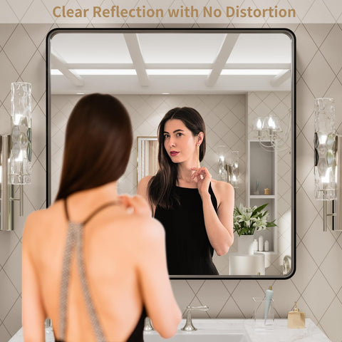 LOAAO rounded rectangle mirror close-up shows sleek matte black frame.