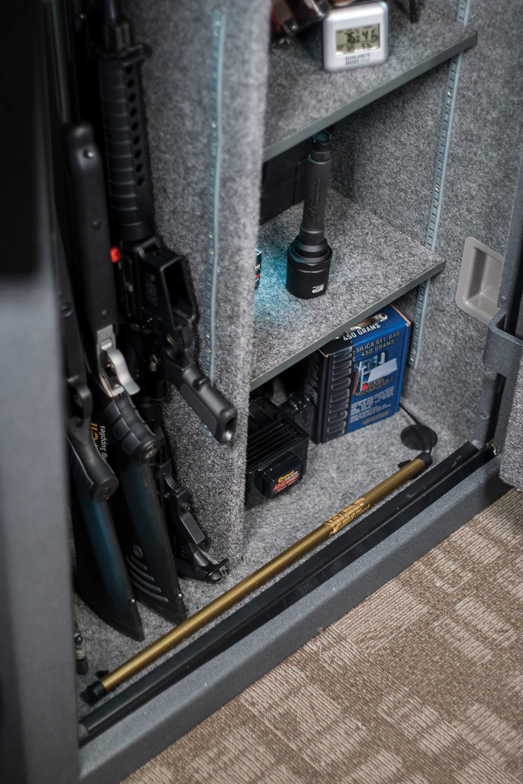 Lockdown Golden Rod Dehumidifier plugged in behind the safe door for simple moisture management.