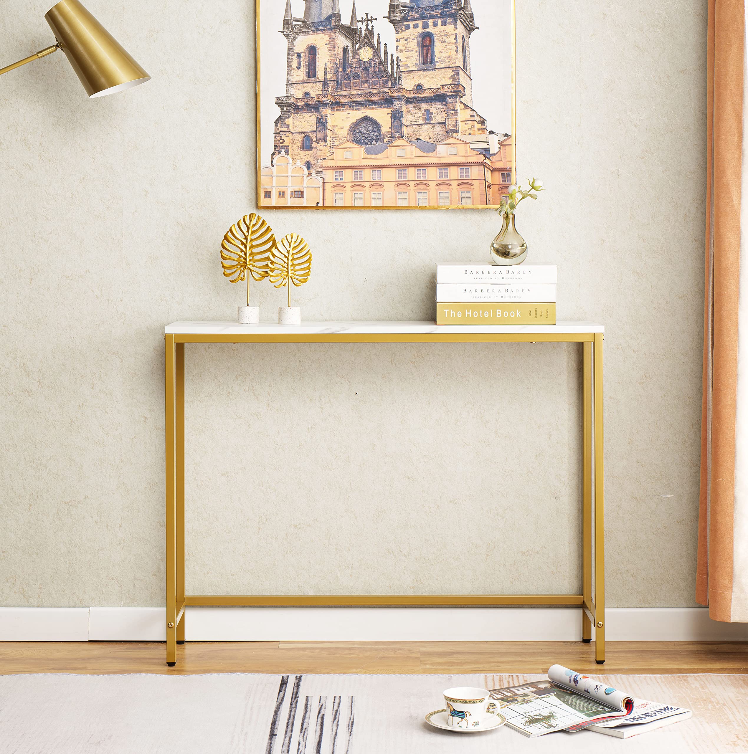 loglus console table with golden frame adds luxury to living room.