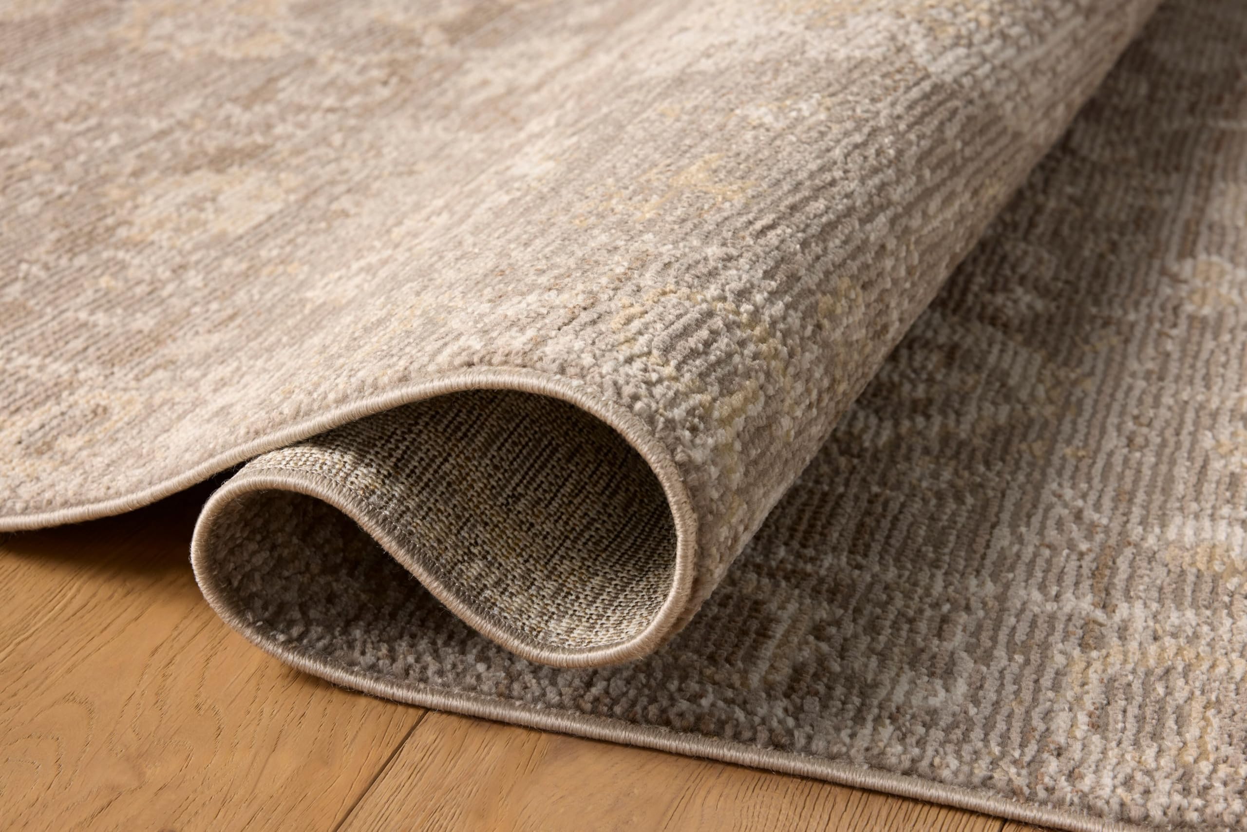Loloi Magnolia Pace PAC-03 taupe-wheat dining room scene showcases easy-care, no-shed design.