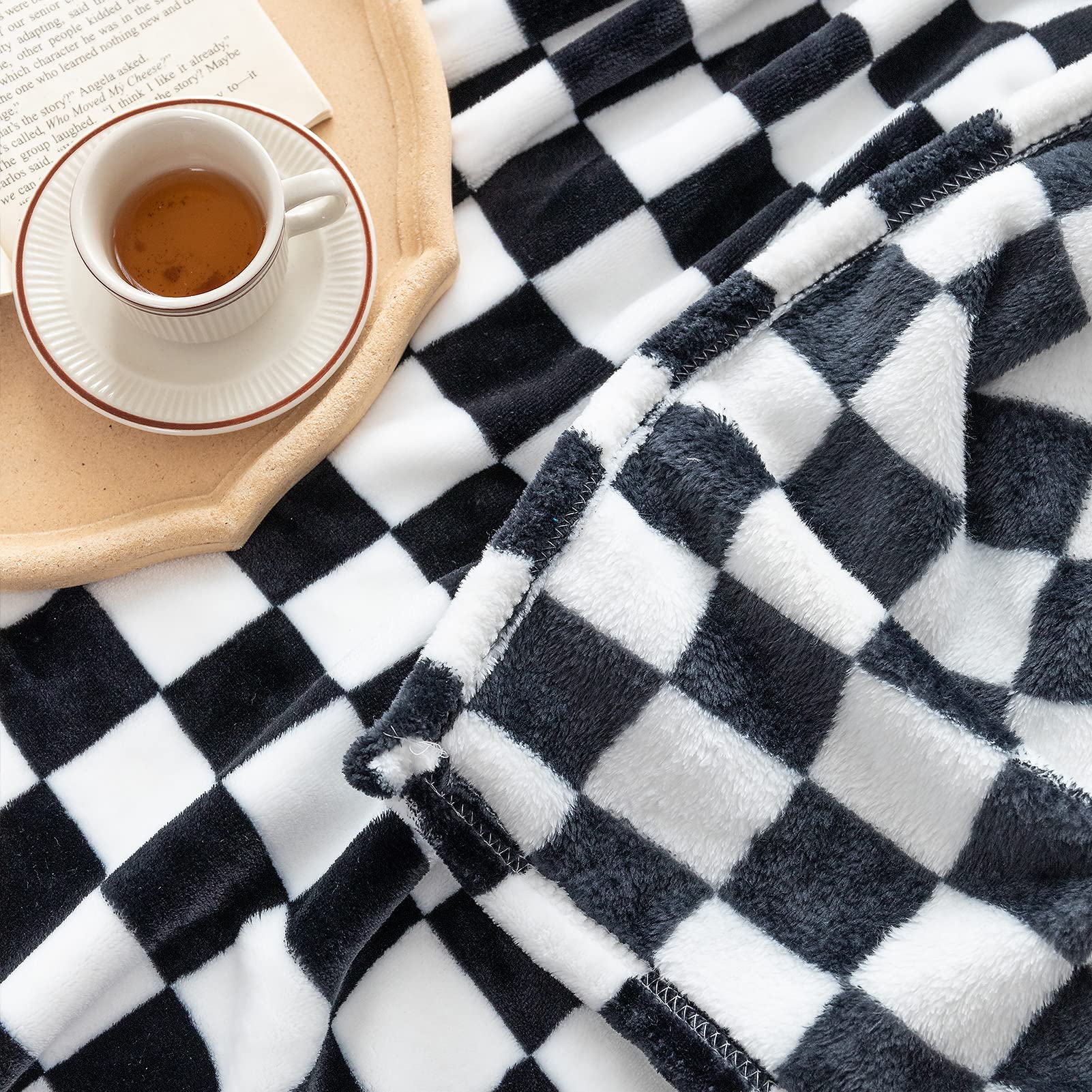 LOMAO multi-functional blanket on sofa and bed for versatile warmth.