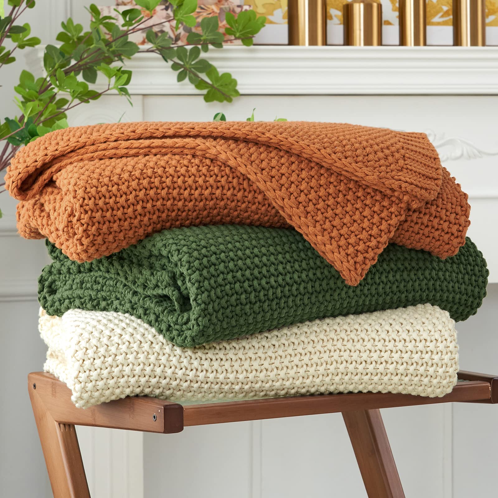 Longhui Bedding chunky knit throw beige on sofa for cozy living room ambience.