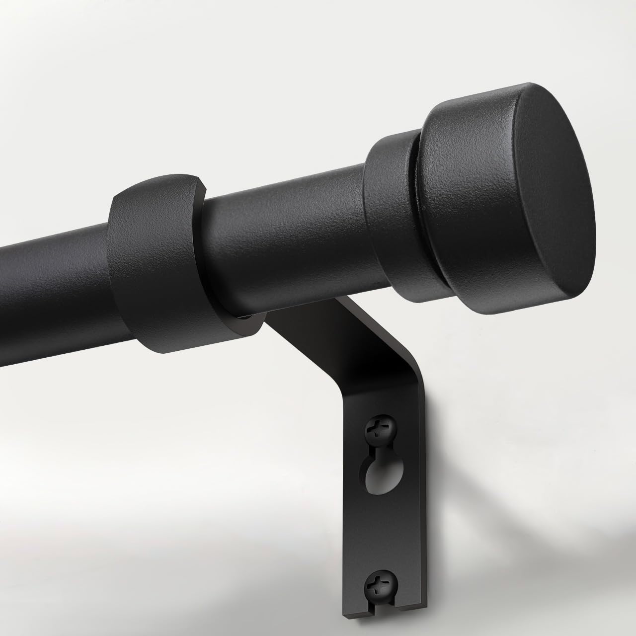 Lootkell matte black curtain rod with solid metal finials provides stable support for drapes