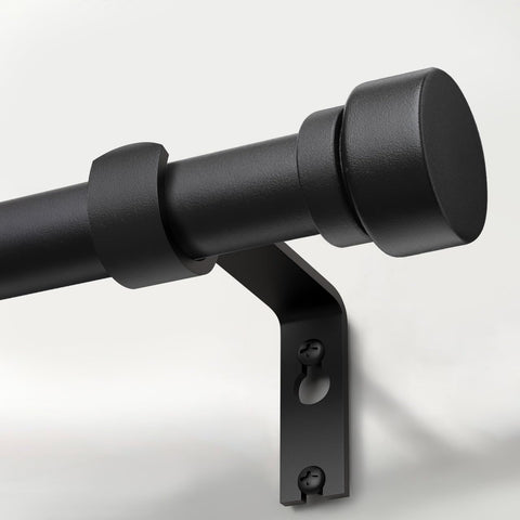 Lootkell matte black curtain rod with solid metal finials provides stable support for drapes