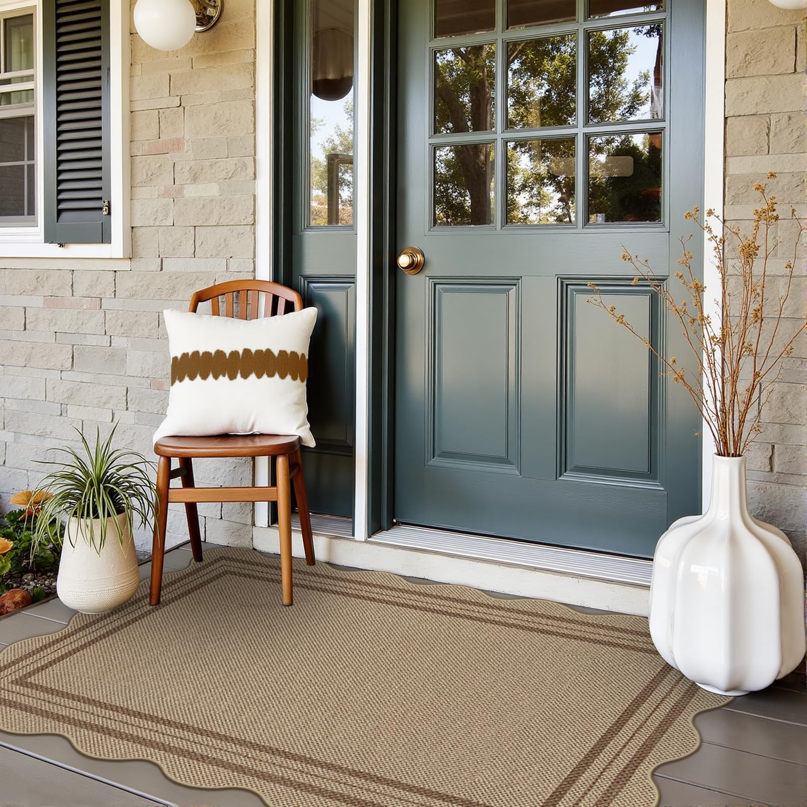 LORWER 3x5 outdoor rug in brown at entryway