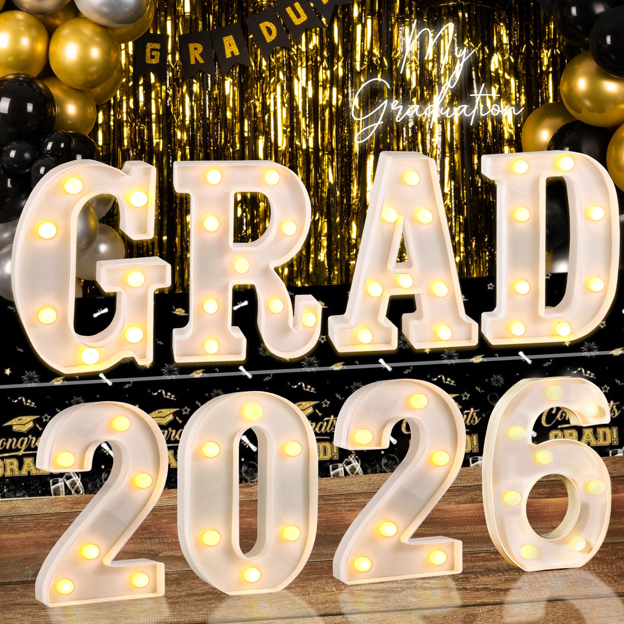 Lotus Hills GRAD 2026 letters illuminate space for photo moments.