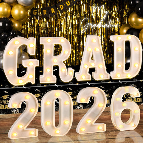 Lotus Hills GRAD 2026 letters illuminate space for photo moments.