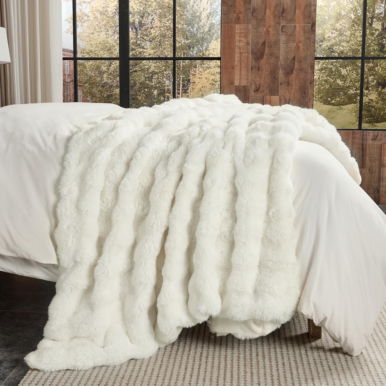 Lotus Karen blanket on sofa enhances living room decor.