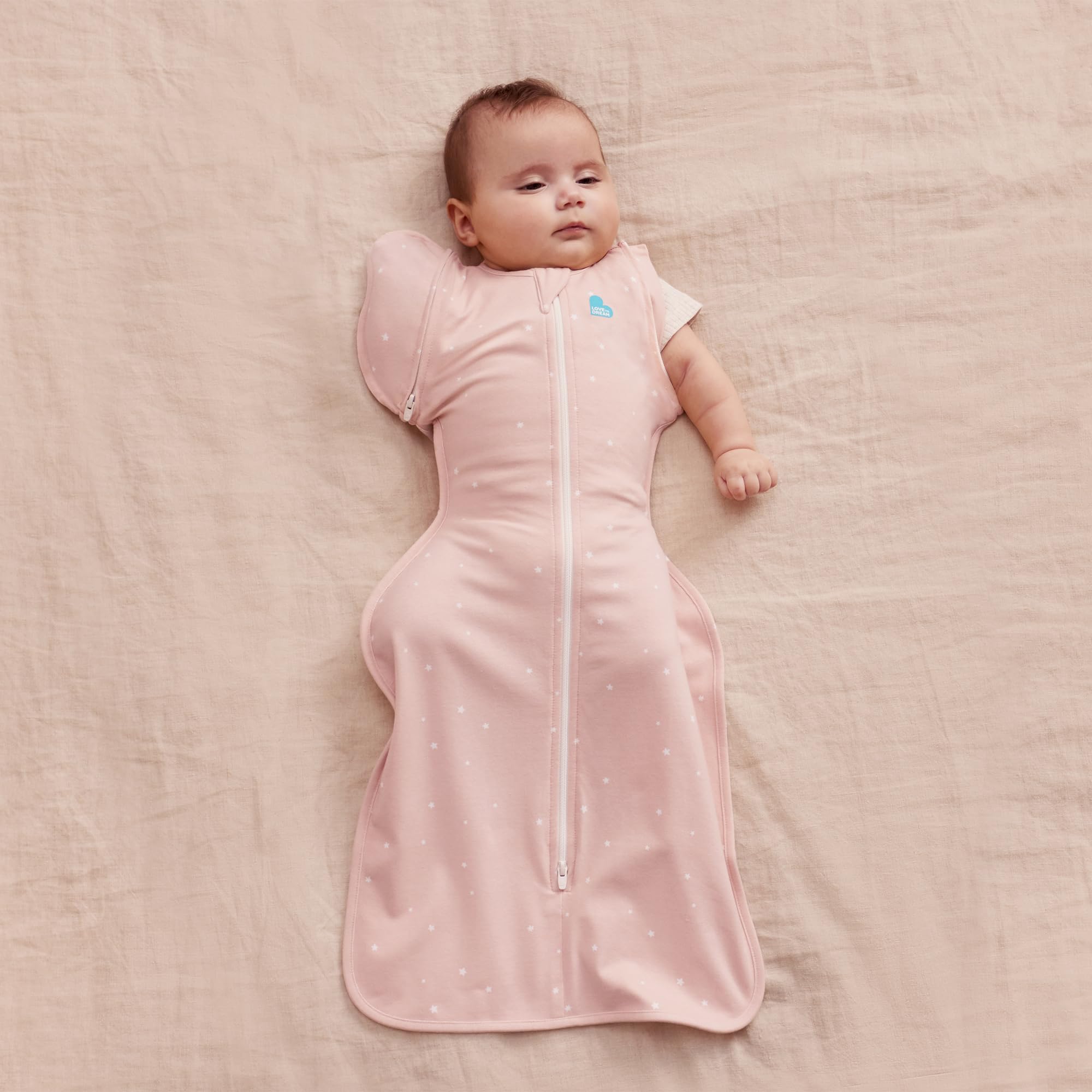 Powder Pink Twinkle transition bag worn by baby during sleep for secure shoulders and comfortable fit.