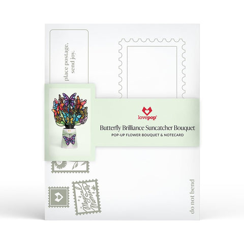 Lovepop Butterfly Brilliance Suncatcher Bouquet rests on a floral base for a delicate centerpiece.