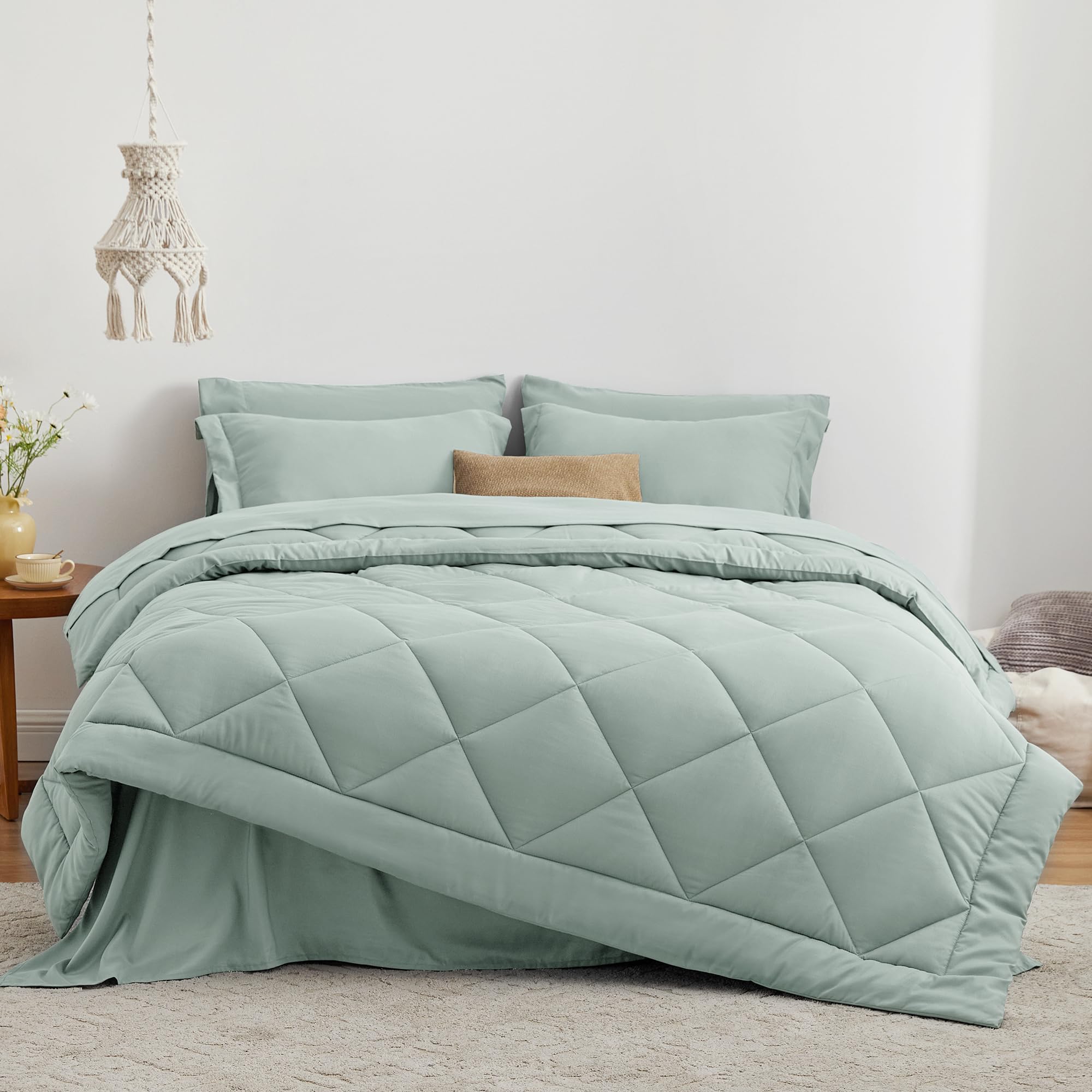 Love's cabin aqua comforter close-up showing box stitching for even fill.