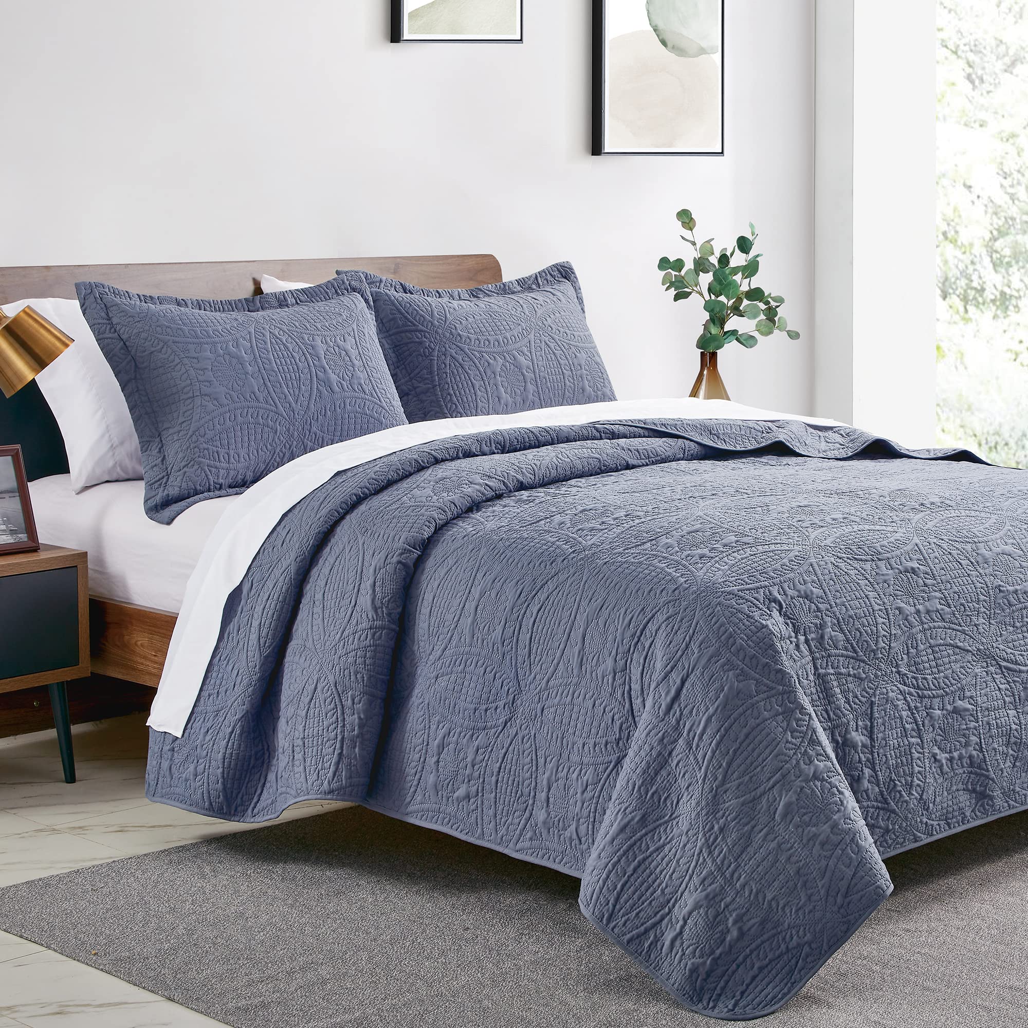 Love's cabin blue bedspread on queen bed highlighting lightweight summer coverlet.