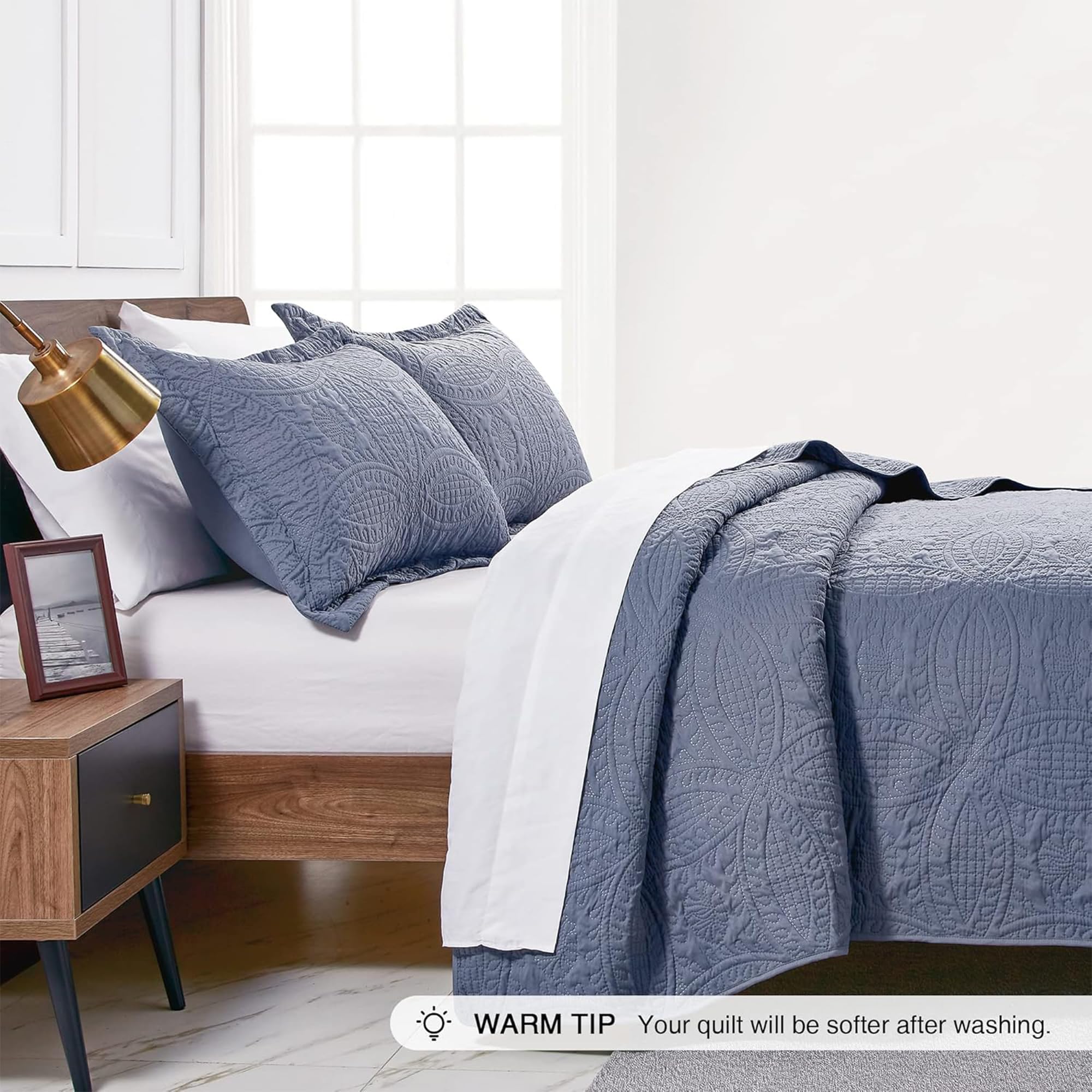 Love's cabin blue quilt shown in a modern bedroom for durable, easy-care styling.
