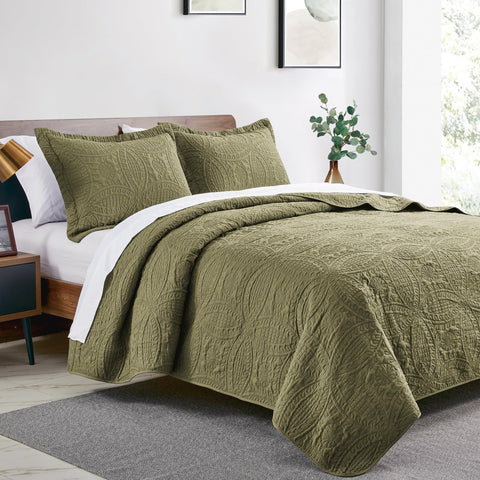 Love's cabin green quilt shams paired for coordinated bedroom styling