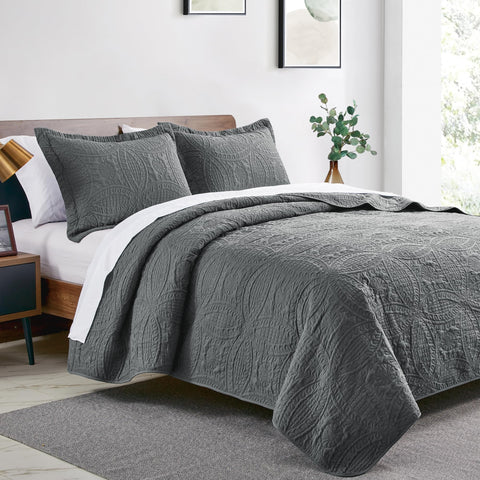 Love's cabin coin-pattern coverlet detail: lightweight and durable for all-season use.