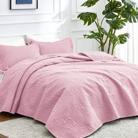 Love's cabin coin-pattern coverlet in pink adds texture