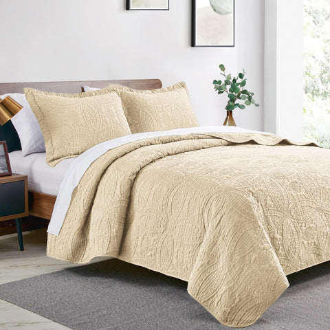 Love's cabin coin-pattern coverlet shows lightweight embossed texture.