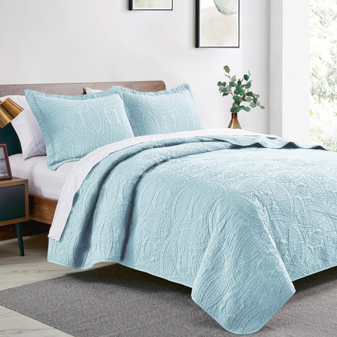 Love's cabin coin-pattern quilt design adds modern texture to bedding