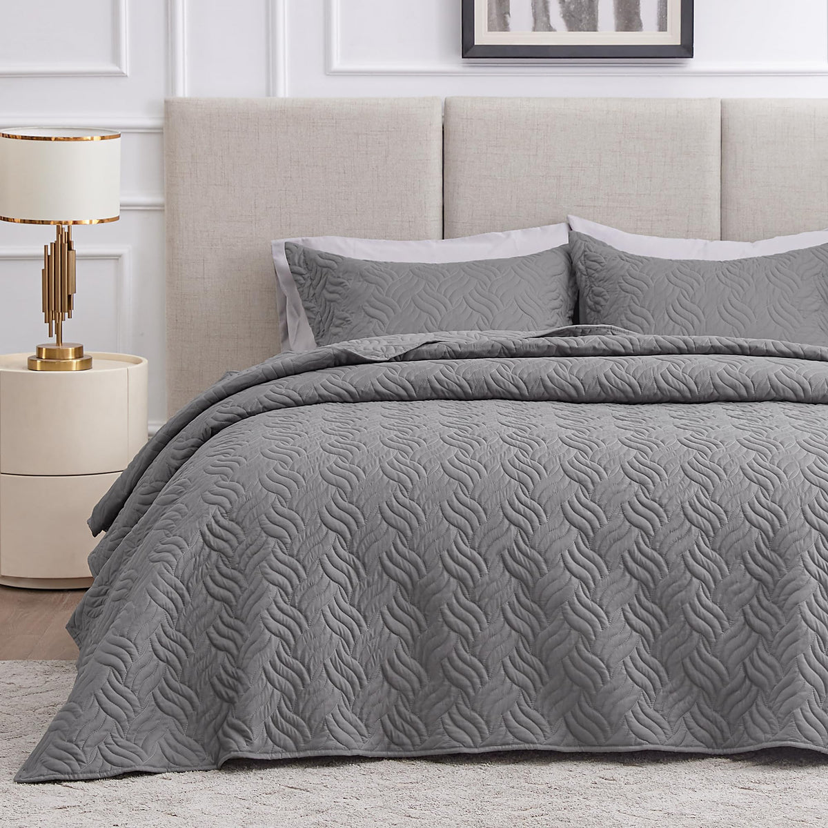 Love's cabin grey wave quilt-queen on bed for a lightweight, cozy feel