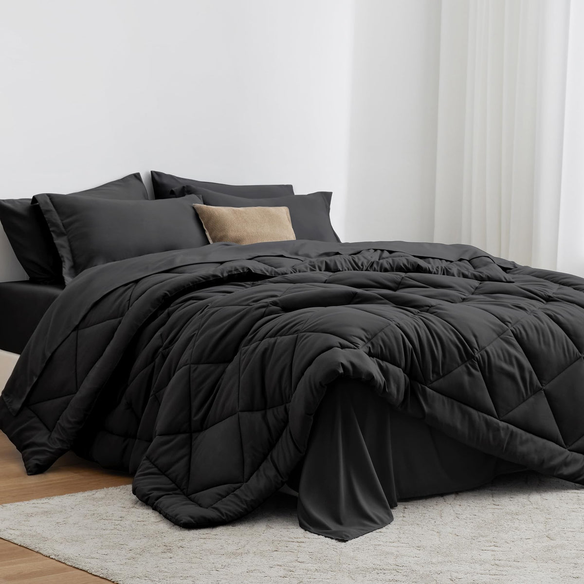Love's cabin king size comforter set in black offers all-season warmth and a cohesive bed look.