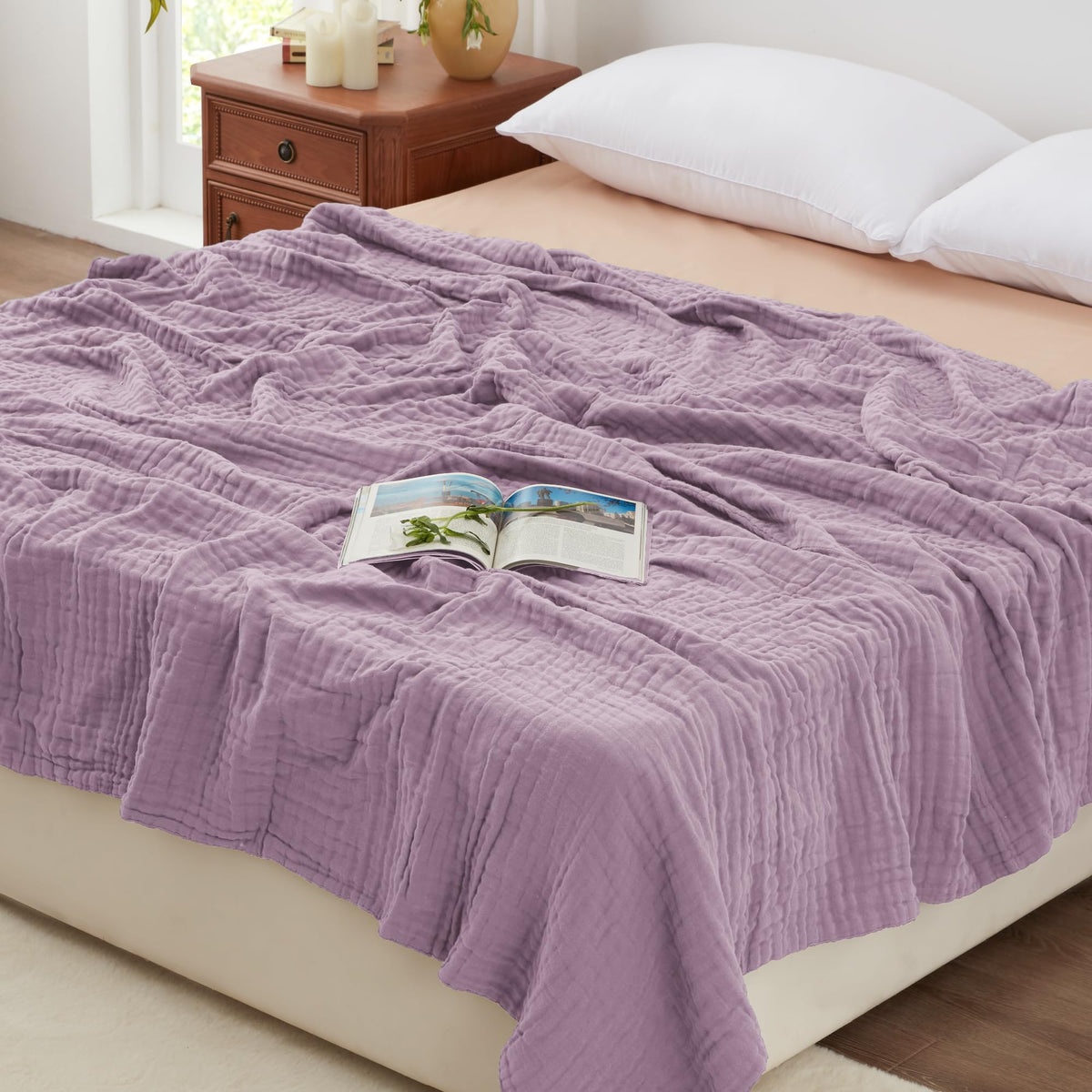 Love's cabin muslin blanket close-up shows six-layer cotton texture for breathable comfort.