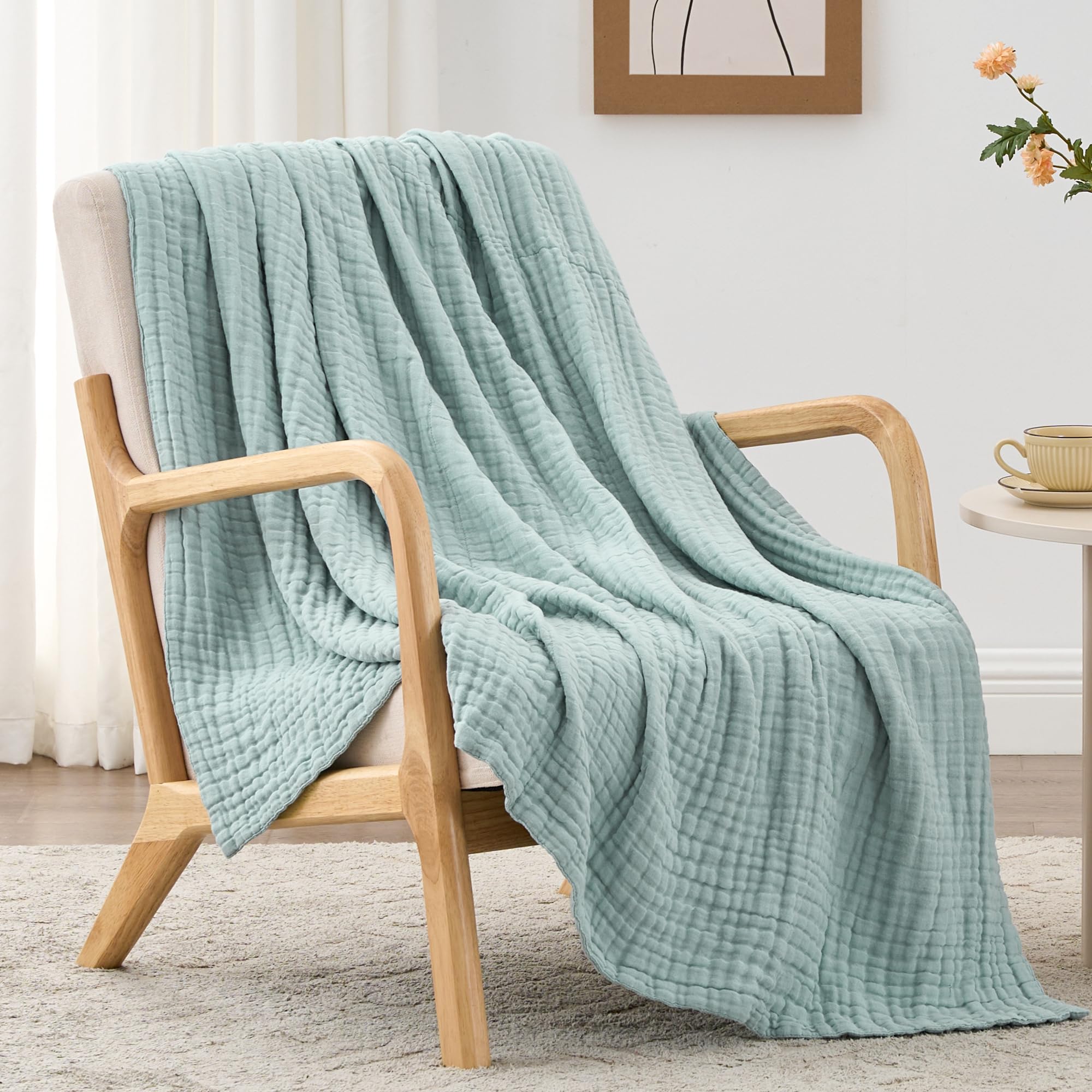 Love's Cabin six-layer muslin blanket on a couch for all-season comfort