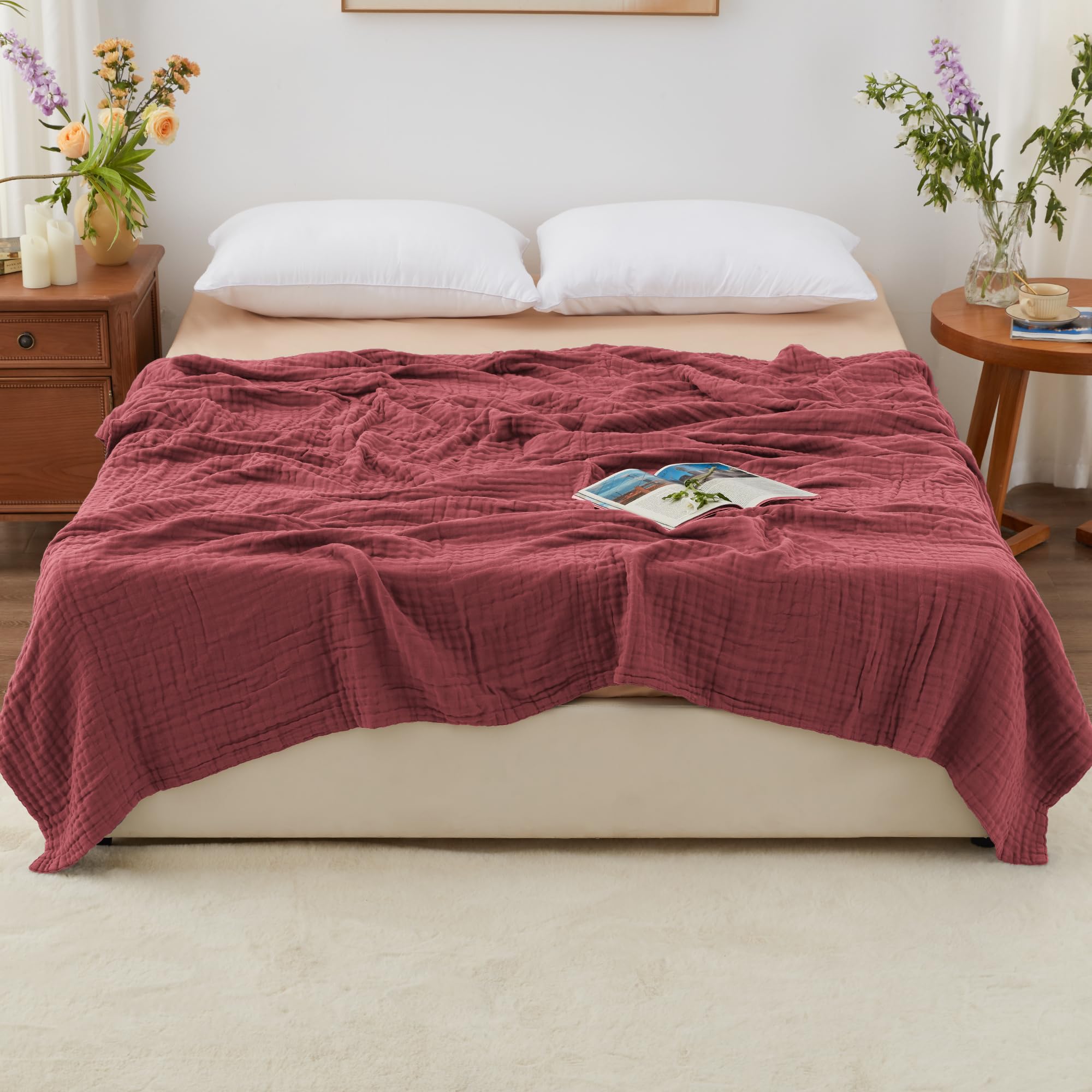 Love's Cabin muslin blanket on bed, soft touch ideal for cozy nights.