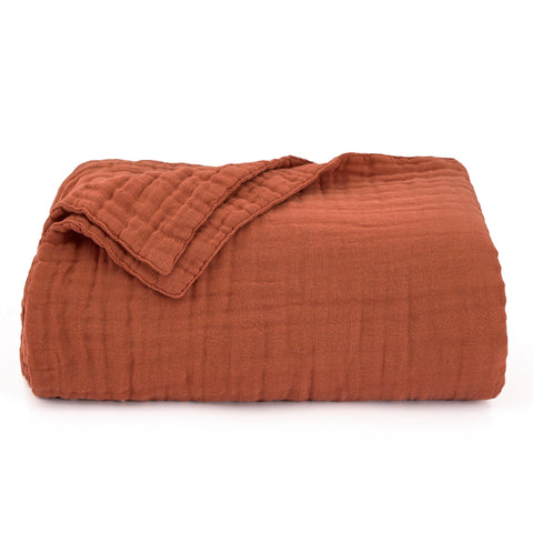 Love's cabin muslin blanket ideal for layering on beds or couches.
