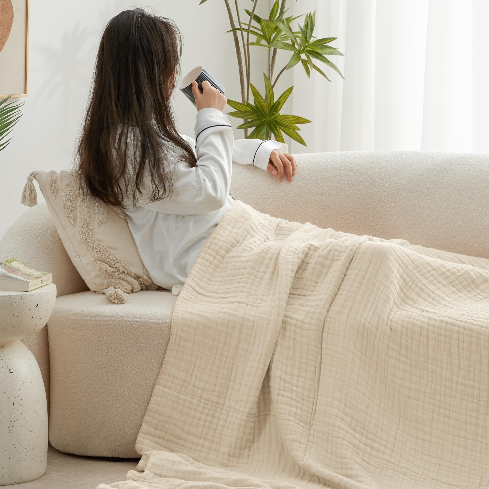 Love's cabin muslin blanket in a travel setup demonstrates portability.