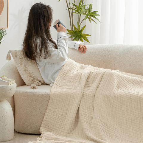 Love's cabin muslin blanket in a travel setup demonstrates portability.