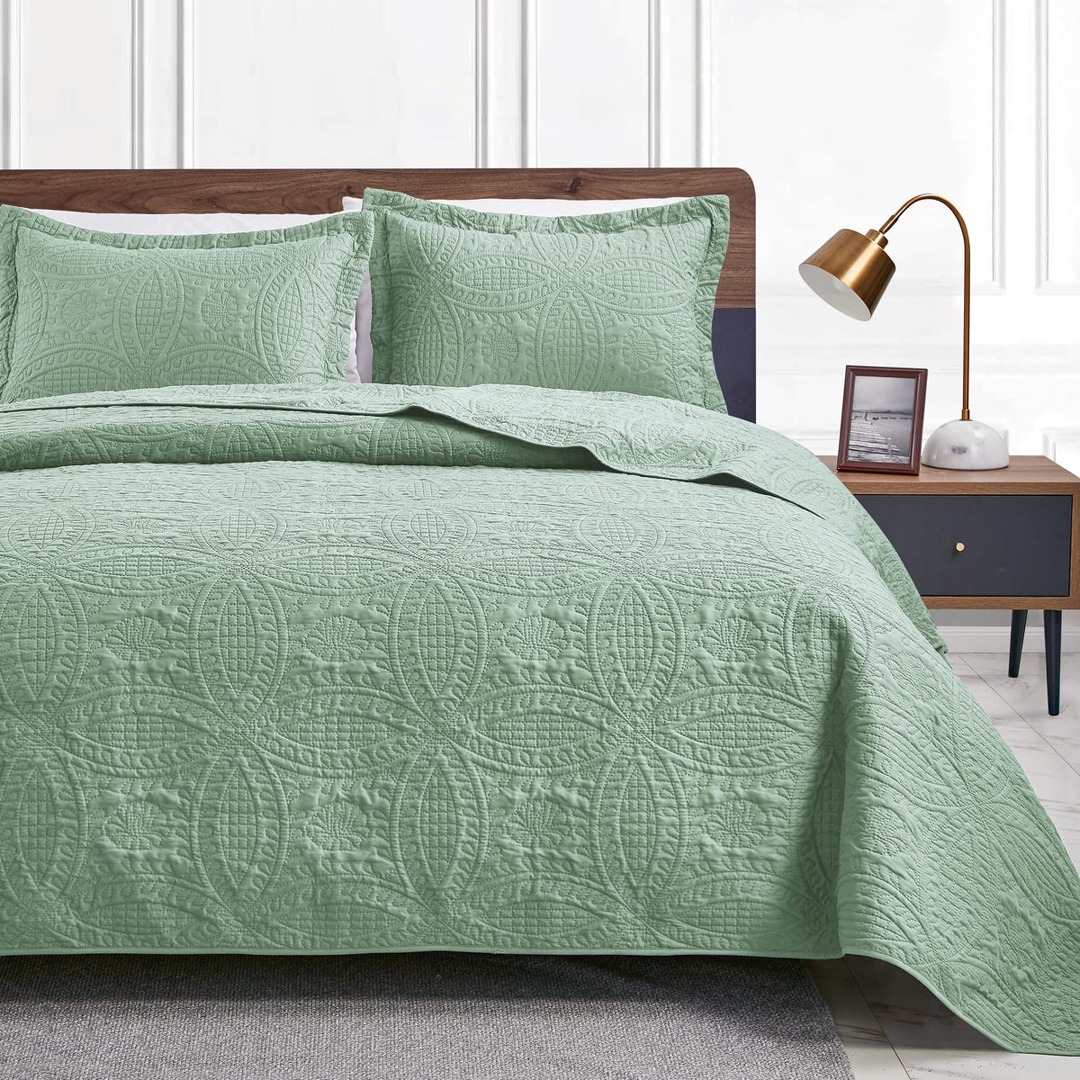 Love's cabin queen quilt in sage draped on bed for year-round comfort.