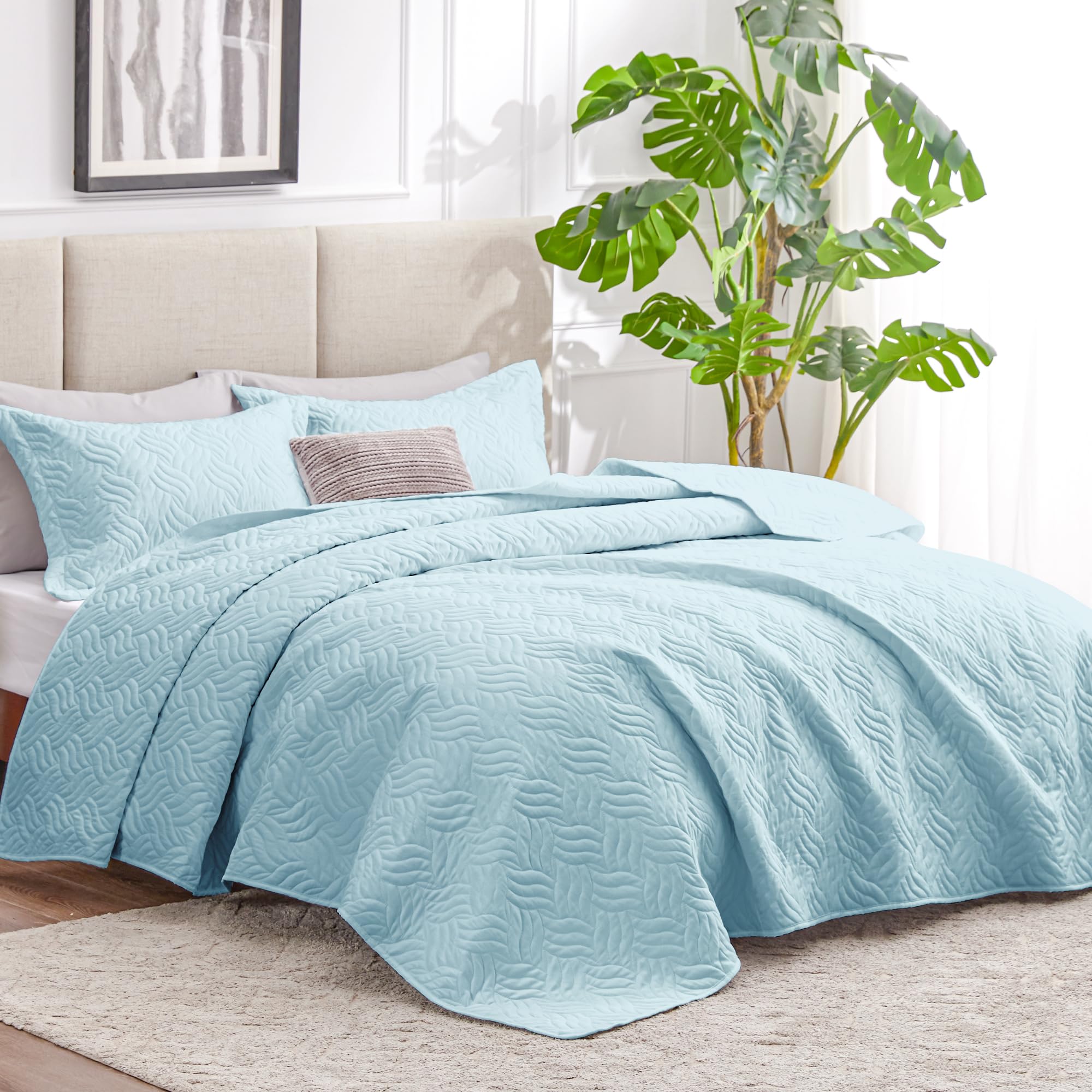Love's cabin queen quilt with two blue shams for a complete look.