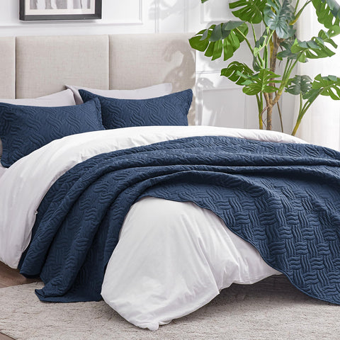 Love's cabin navy quilt close-up shows soft brushed polyester texture