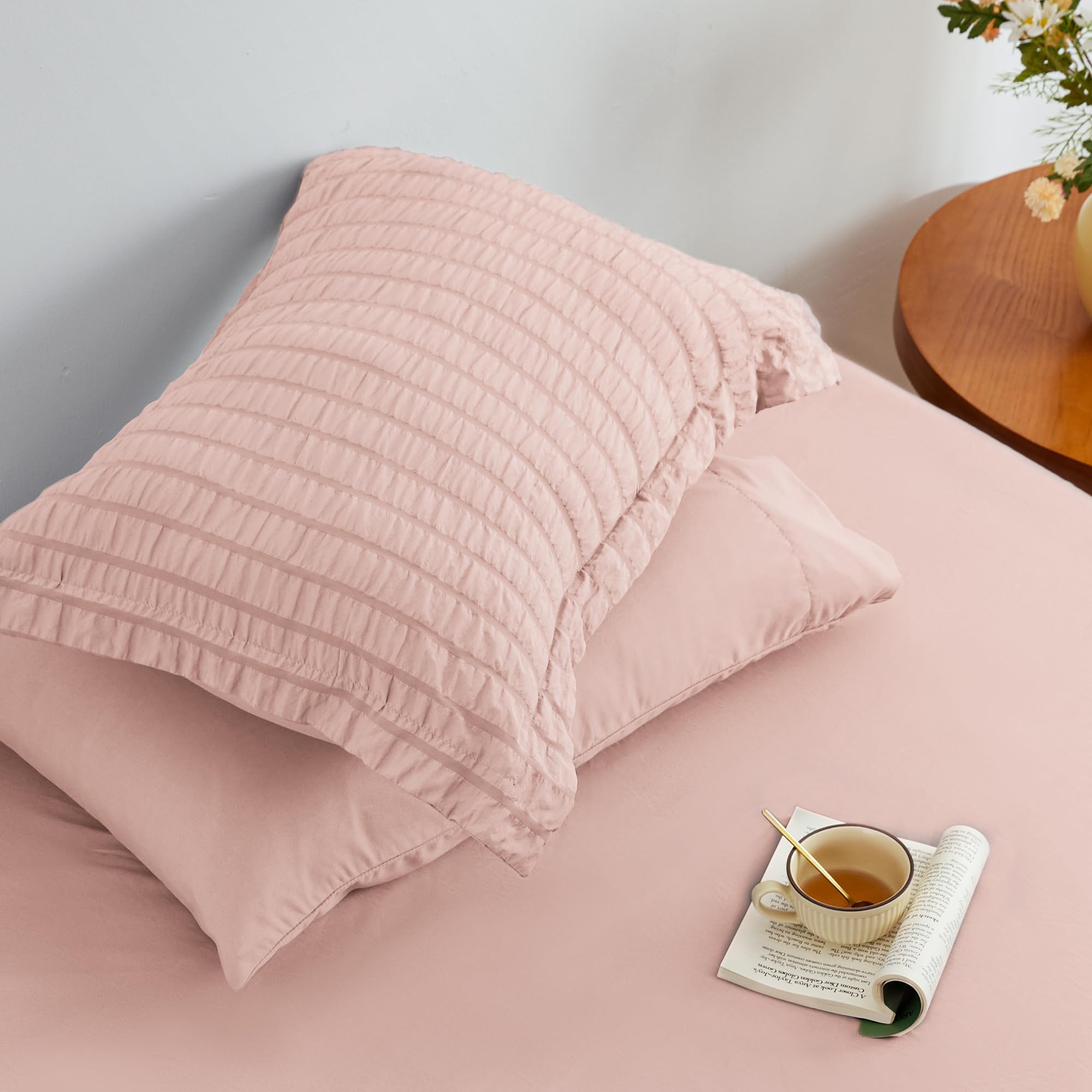 Love's cabin seersucker pink twin sham completes coordinated bedroom look.