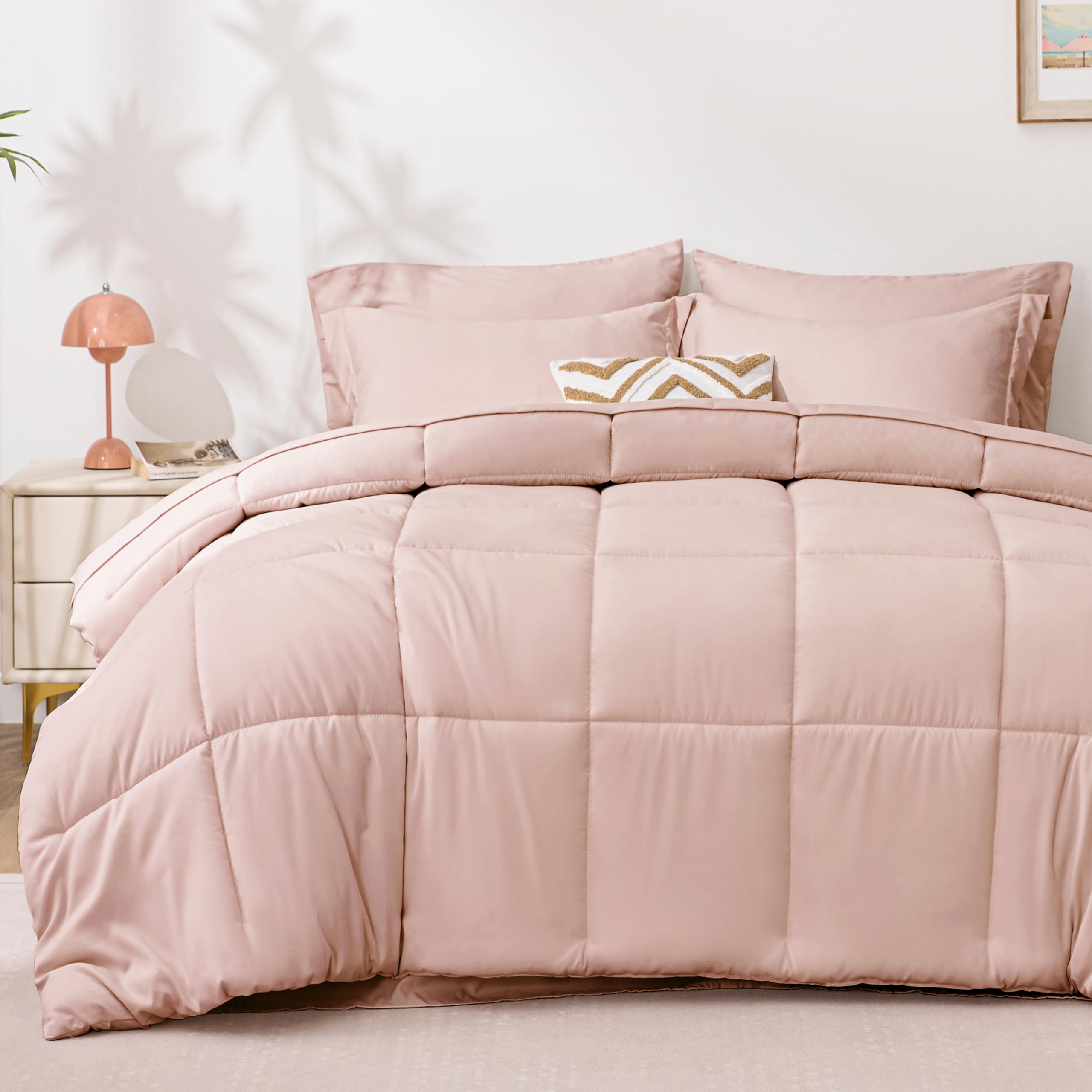 Love's Cabin twin comforter set on a bed in blush pink with a soft, inviting texture.