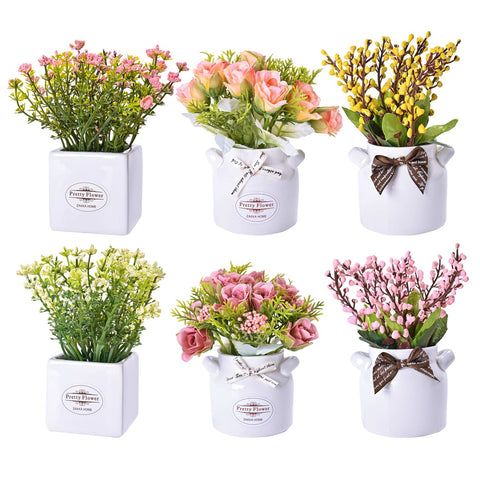 LUEUR artificial flowers in a ceramic pot centerpiece for a stylish table decor.