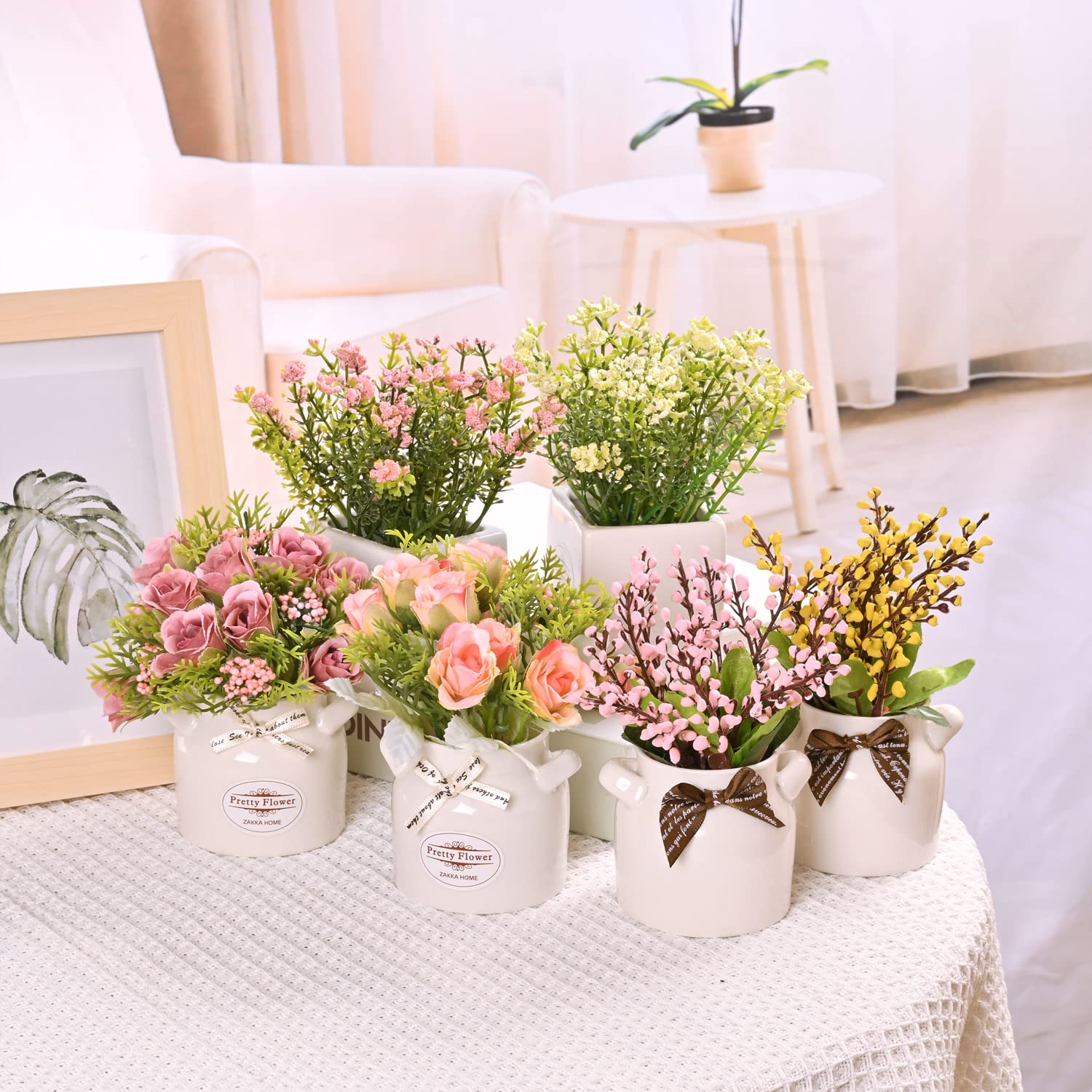 LUEUR six artificial stems in ceramic pots create a timeless table centerpiece.