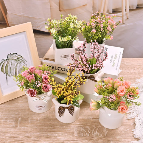 LUEUR faux flowers in porcelain pots suited for shelves and desks.