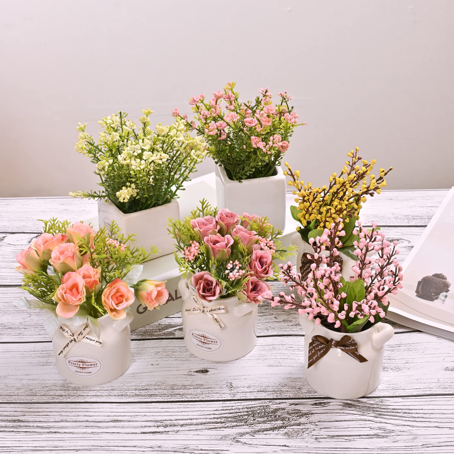 LUEUR decorative artificial blooms in ceramic pots add color to any room.