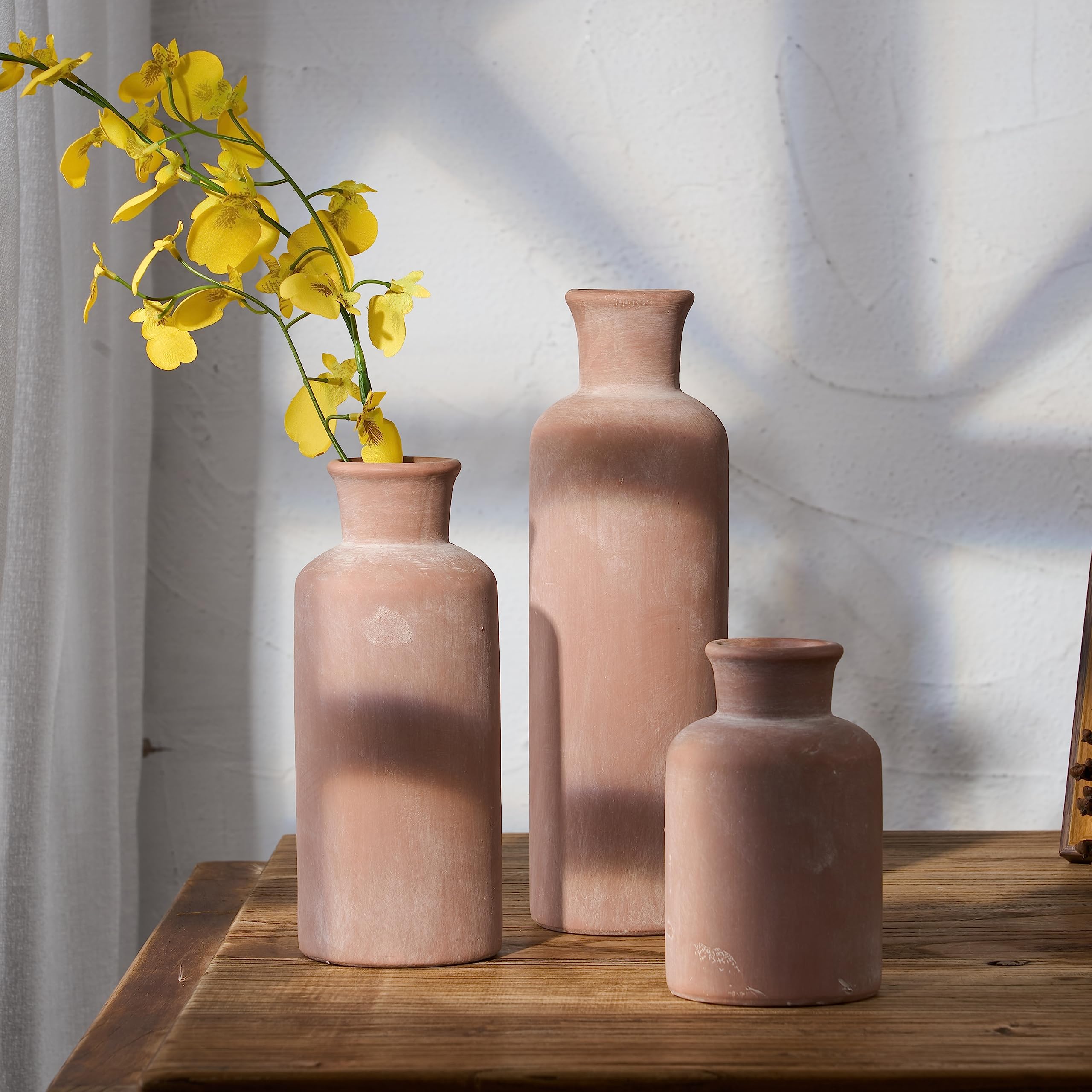 LUKA ceramic vase on fireplace adds cozy, rustic warmth
