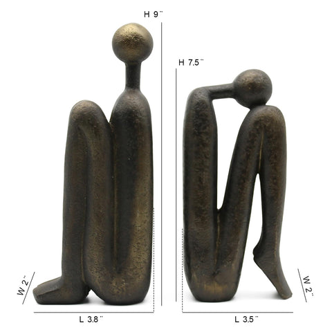 Lukitas thinker figurines decor on a shelf adding character and charm.