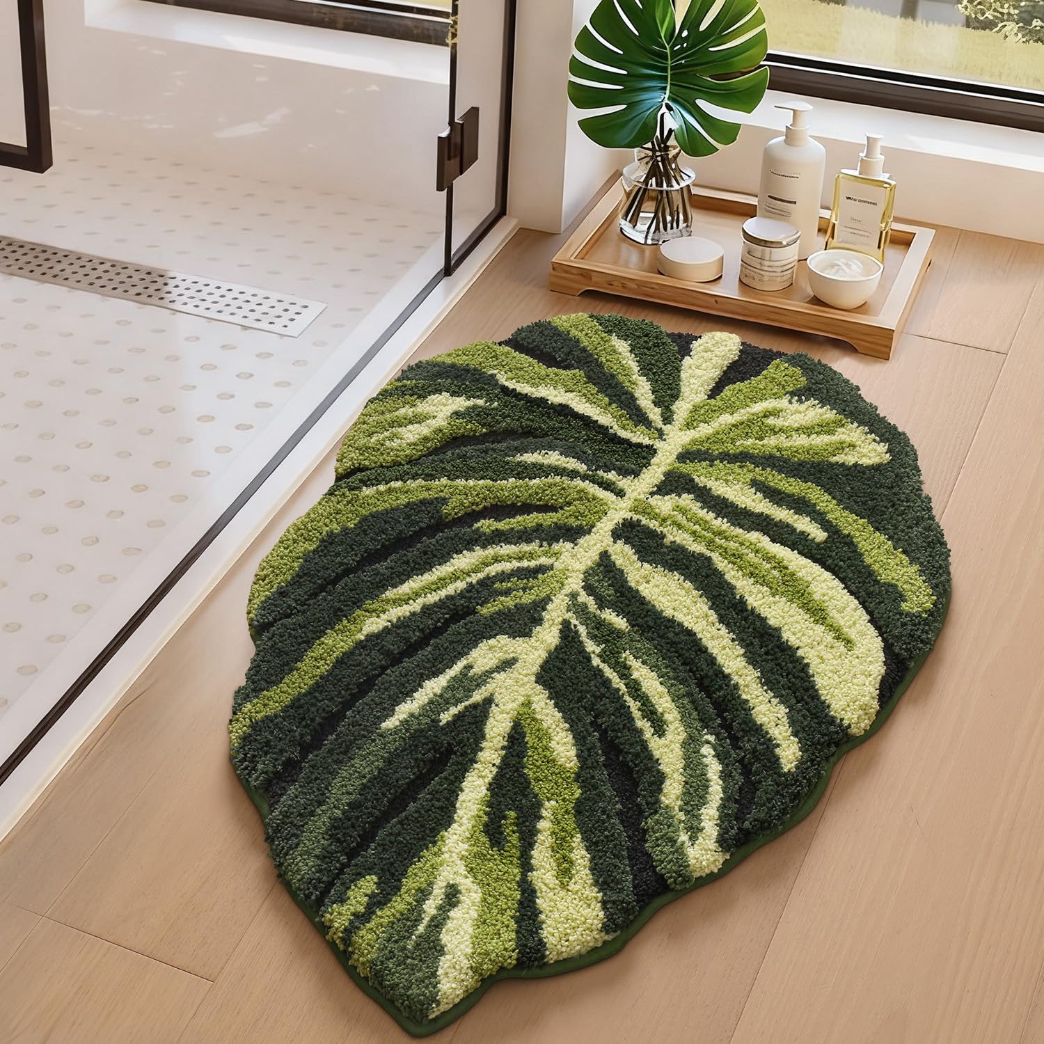 LUMI green-monstera-leaf rug emphasizes plush softness underfoot in a modern bath.