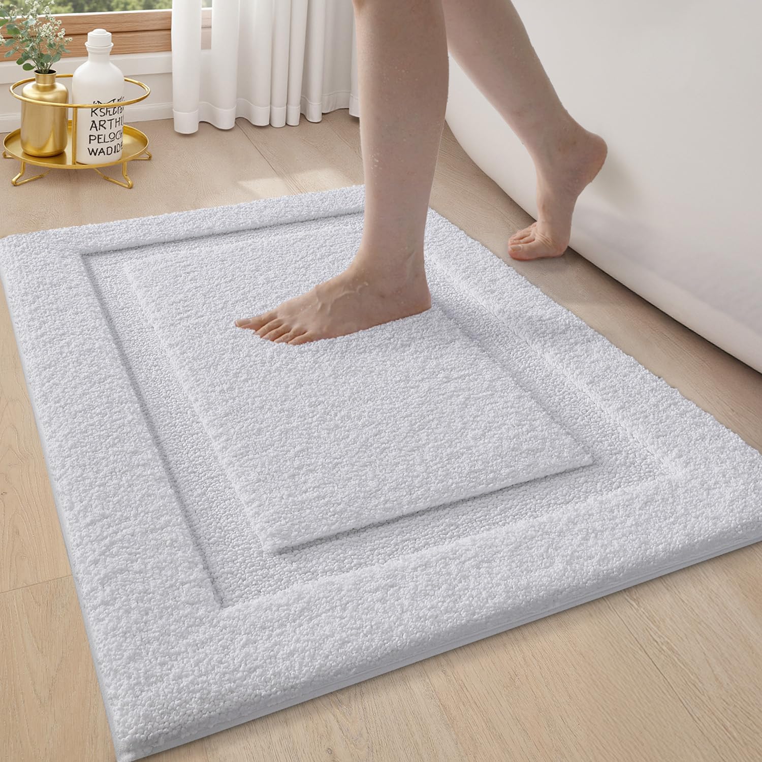 LUMI luxe white bathroom rug complements modern decor.