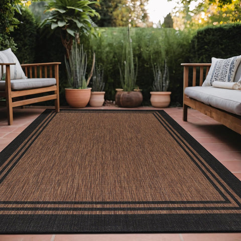 Luul Home bordered outdoor rug 6x9 Nut Brown for patio offers warm, welcoming style.