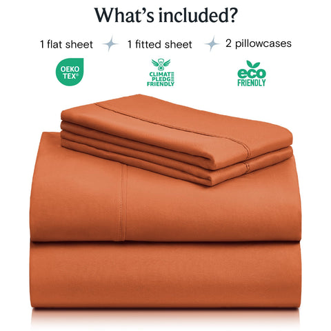 LuxClub queen sheets folded on bed show silky texture and easy care.