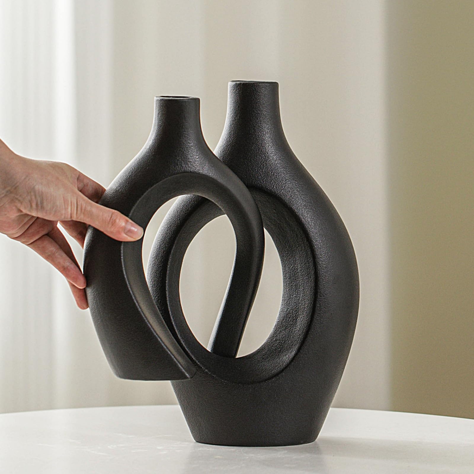 Lvases Snuggle Hollow neck opening detail highlights sleek ceramic finish.