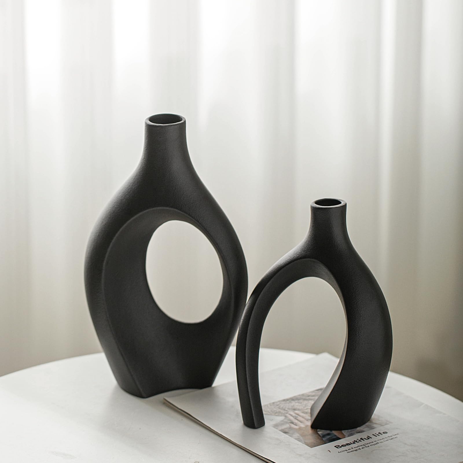 Lvases Snuggle Hollow short vase in matte black ideal for tabletop décor.