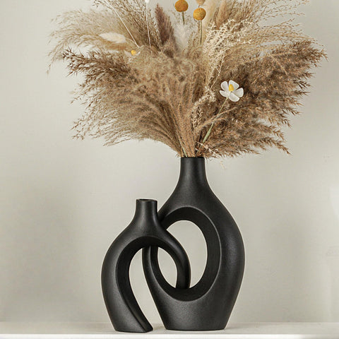 Lvases Snuggle Hollow tall vase in matte black for dramatic centerpieces.