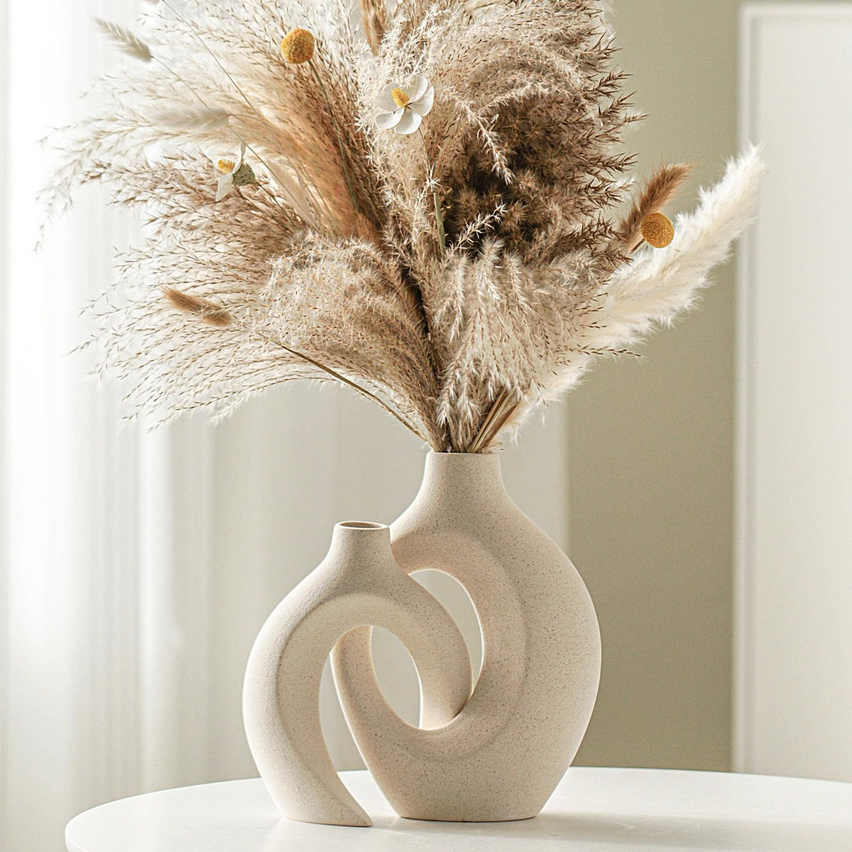Lvases Snuggle Hollow two-piece milky white vase set for minimalist decor.