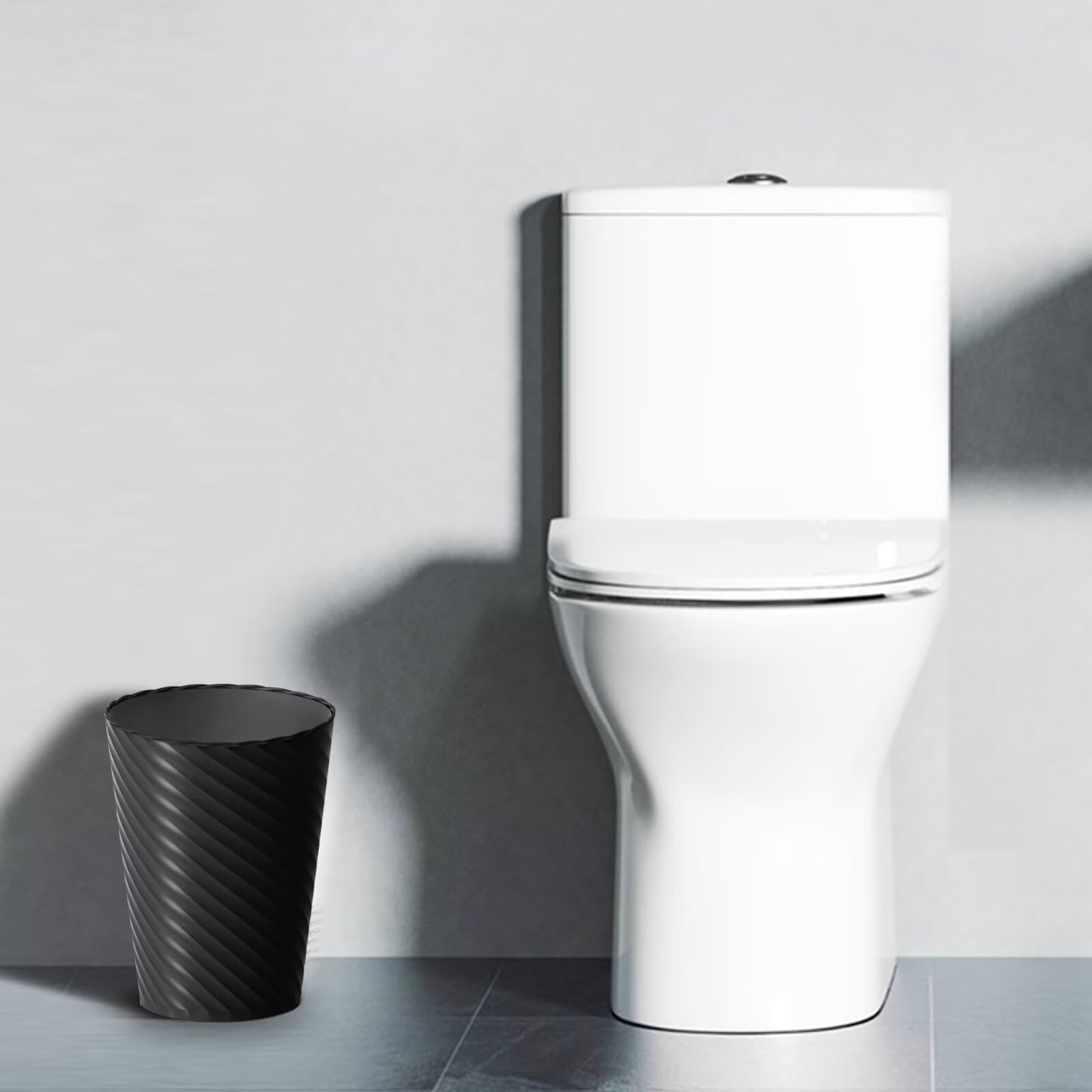 Lysam bathroom trash can in round form, durable PP plastic design.